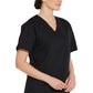 Unisex top met V-hals die in de broek gedragen kan worden met borstzak en zijsplitten