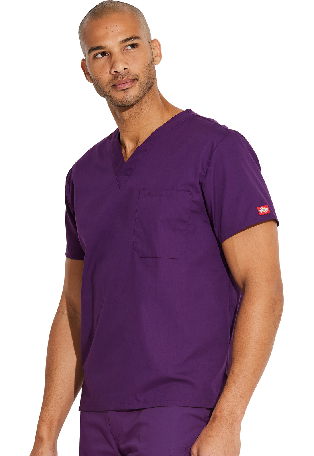 Unisex top met V-hals die in de broek gedragen kan worden met borstzak en zijsplitten