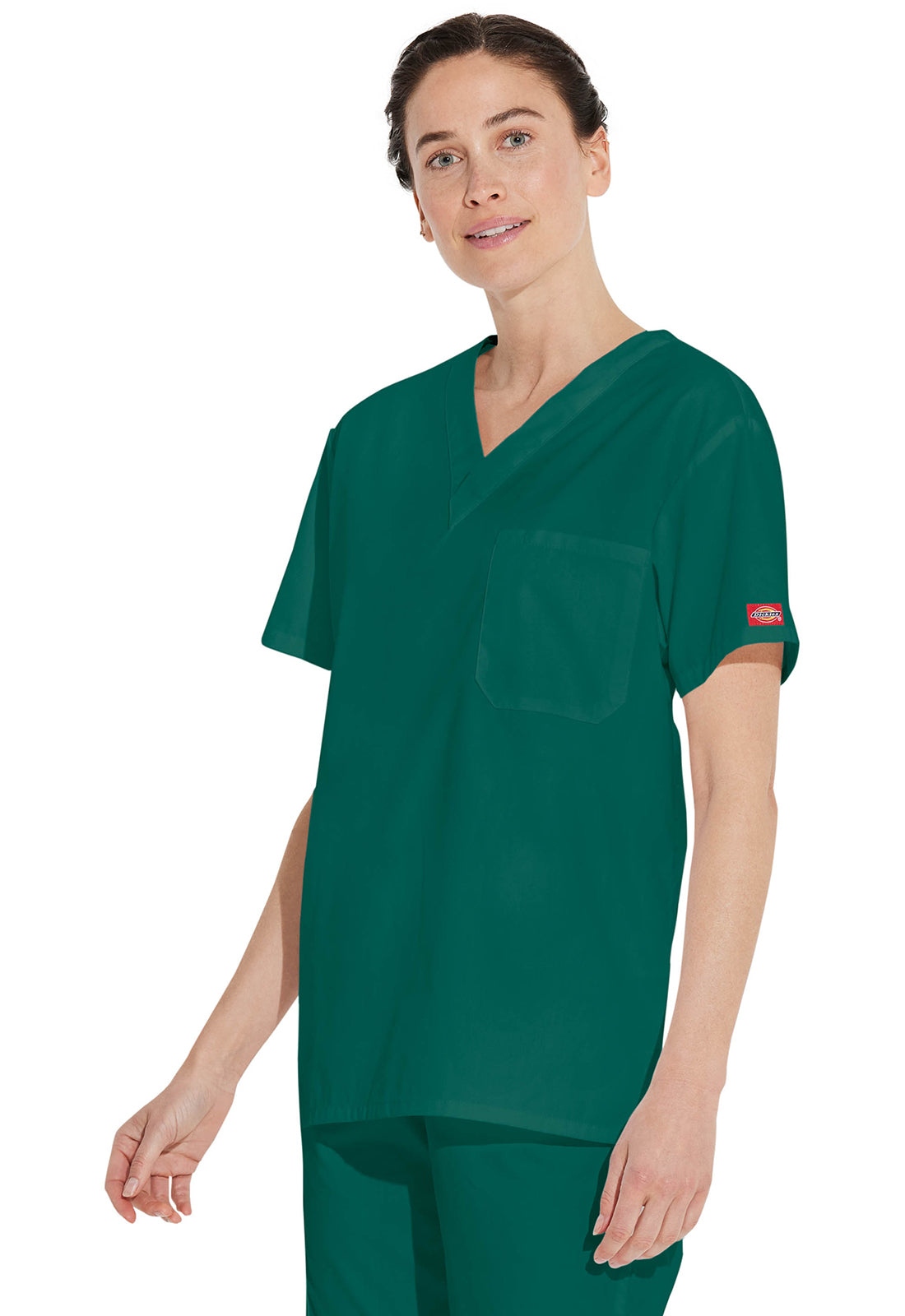 Unisex top met V-hals die in de broek gedragen kan worden met borstzak en zijsplitten
