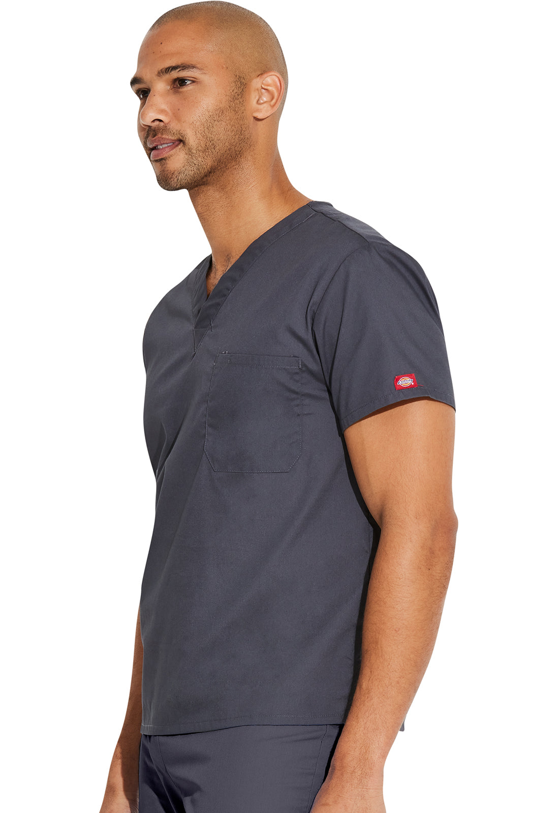 Unisex top met V-hals die in de broek gedragen kan worden met borstzak en zijsplitten