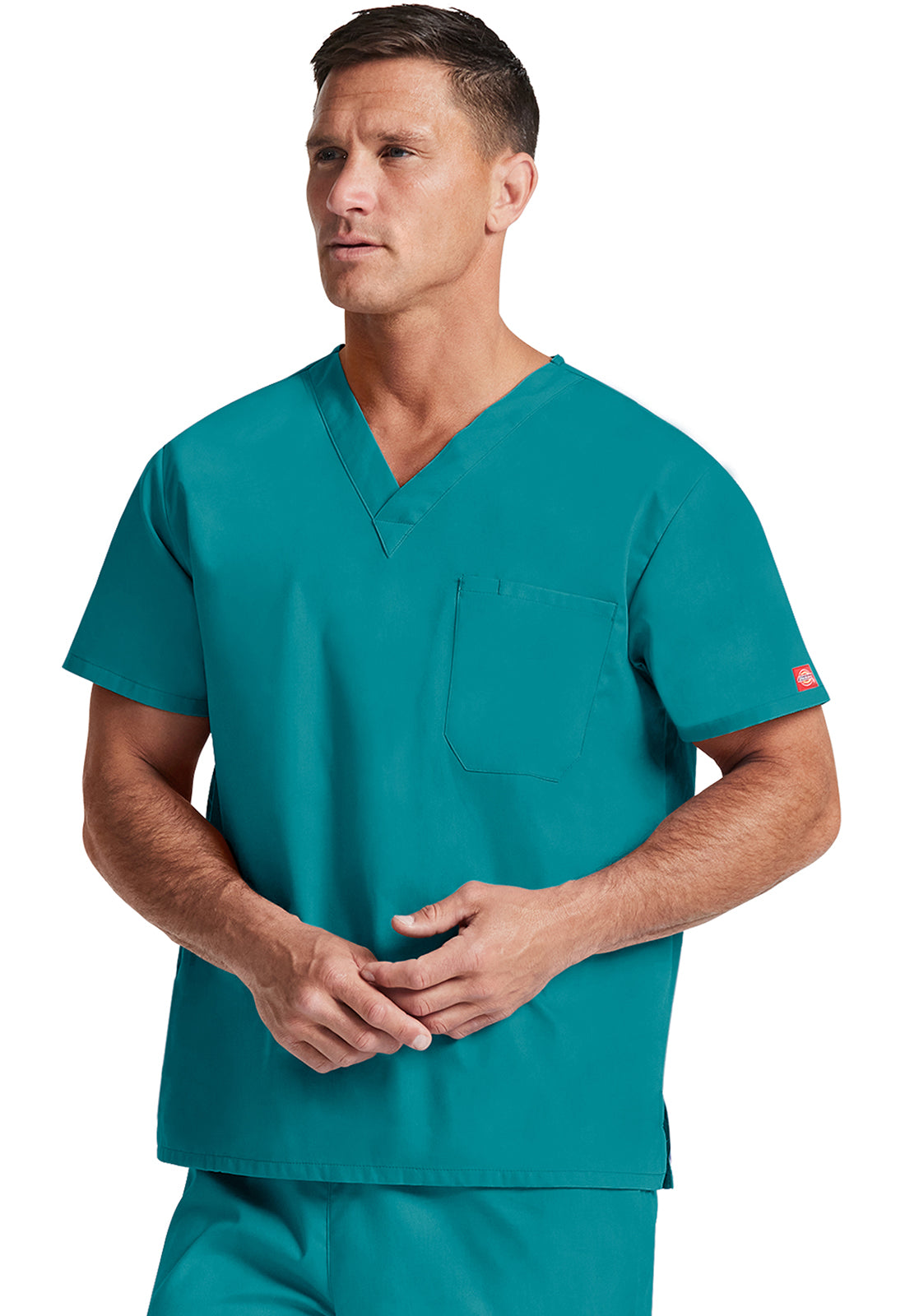 Unisex top met V-hals die in de broek gedragen kan worden met borstzak en zijsplitten