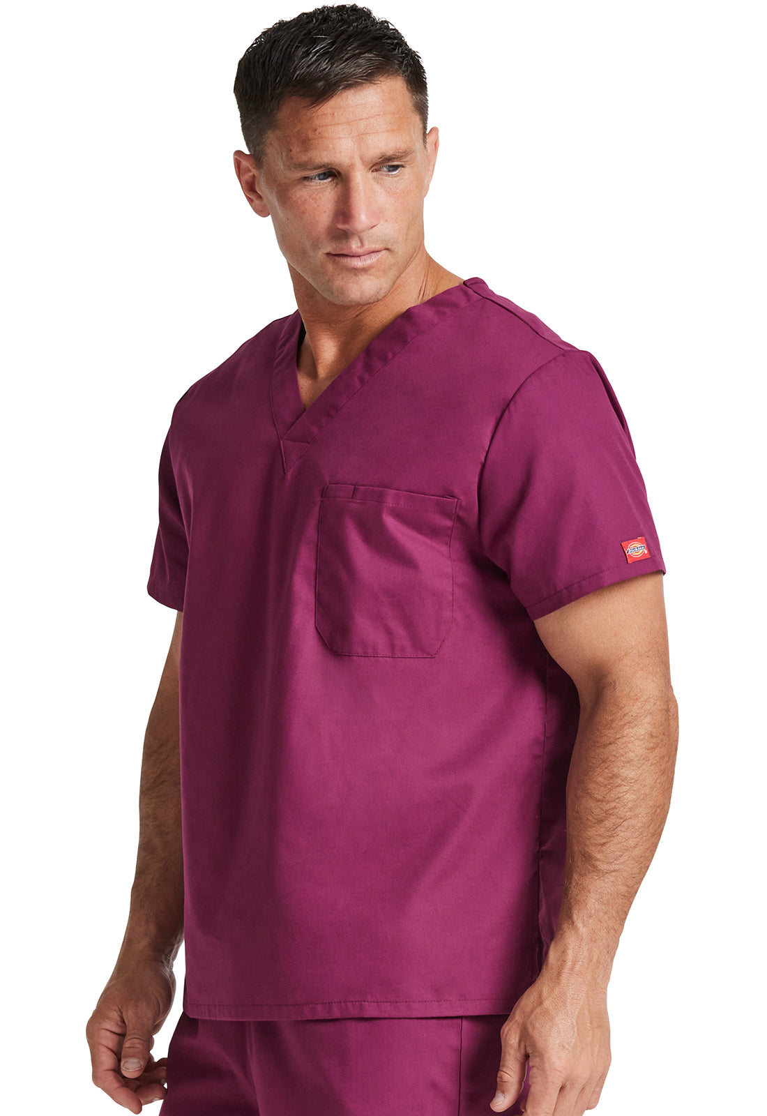 Unisex top met V-hals die in de broek gedragen kan worden met borstzak en zijsplitten