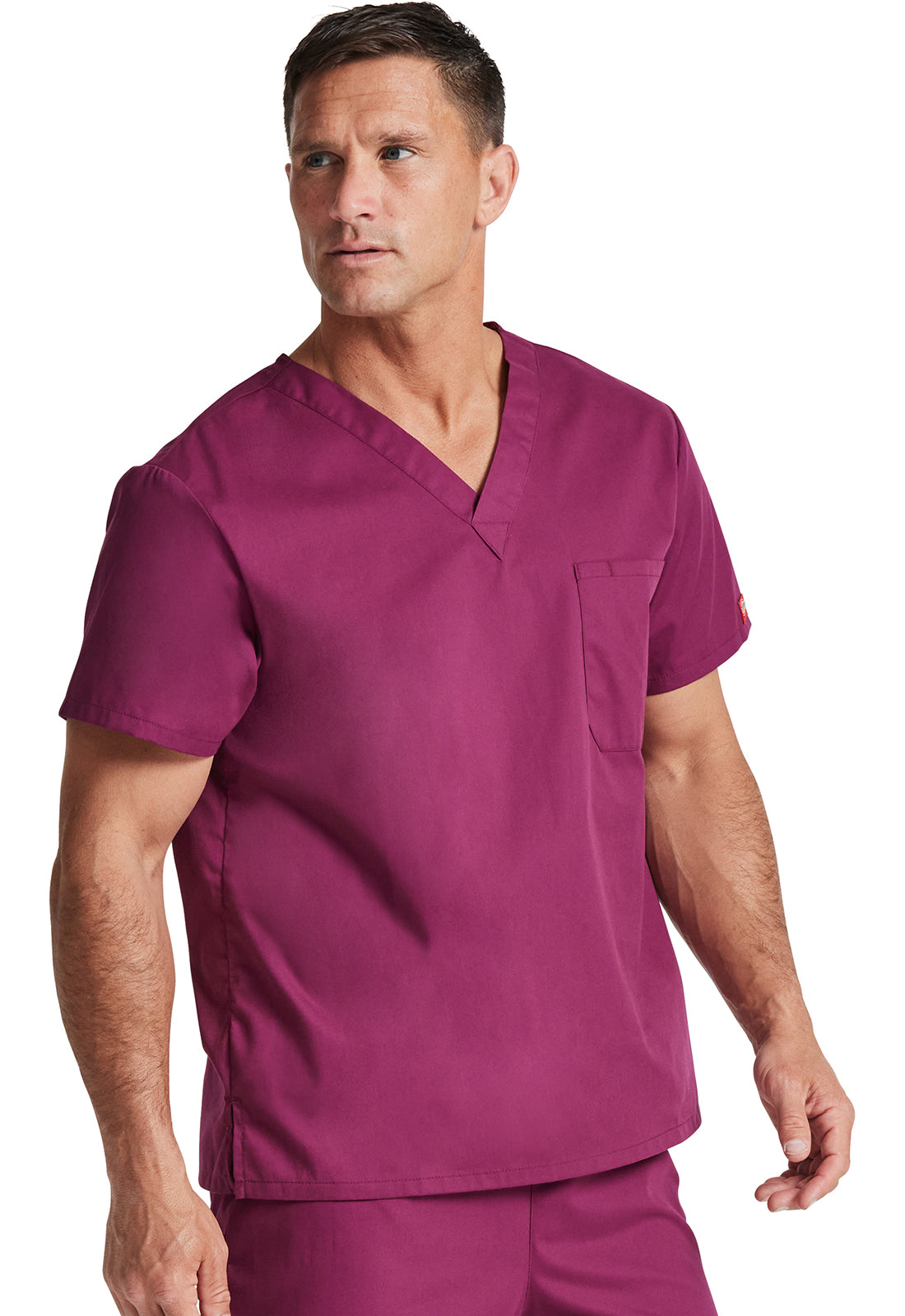 Unisex top met V-hals die in de broek gedragen kan worden met borstzak en zijsplitten