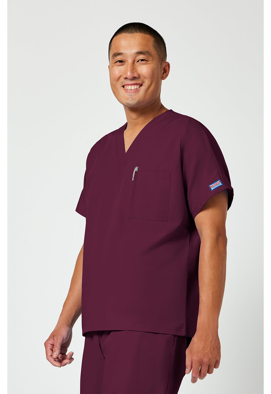 Cherokee Workwear Unisex tuniek met V-hals met vleermuismouwen en borstzak WWE4777