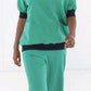 OK-omloopbroek Rhus groen - Zorgkleding.be